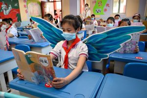 kids in school with masks and wings for social distance