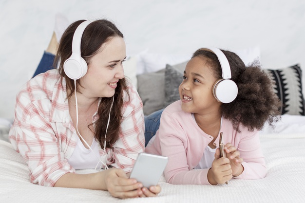 Mother and daughter listening to Tomatis Method